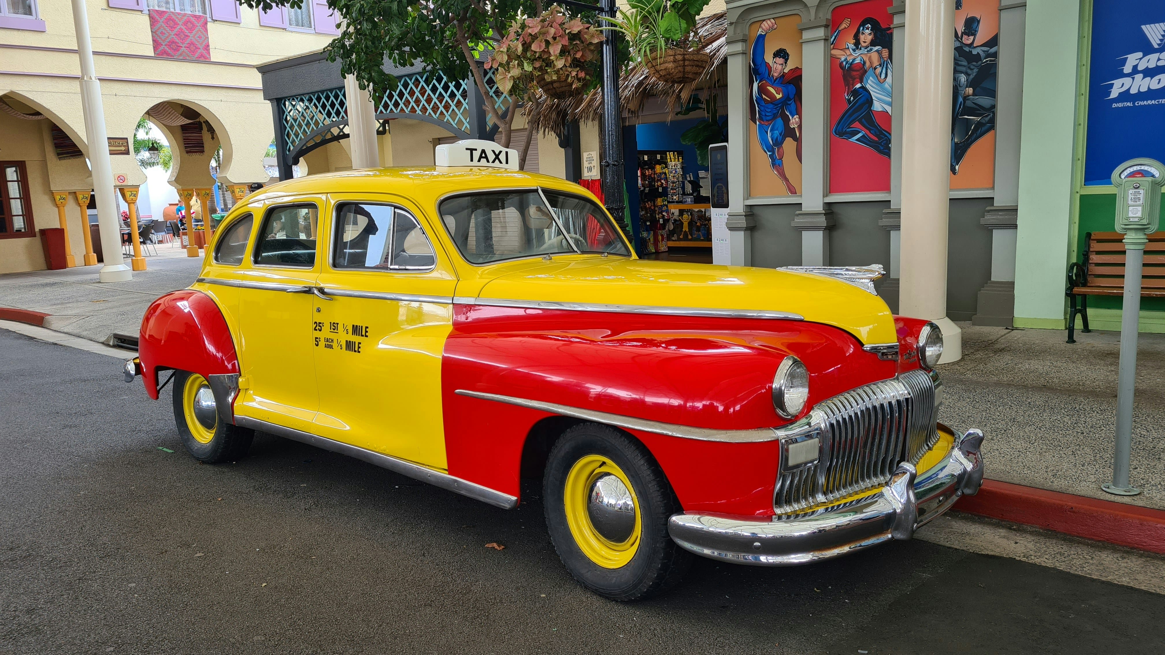 Vibrant vintage taxi cab parked on street.