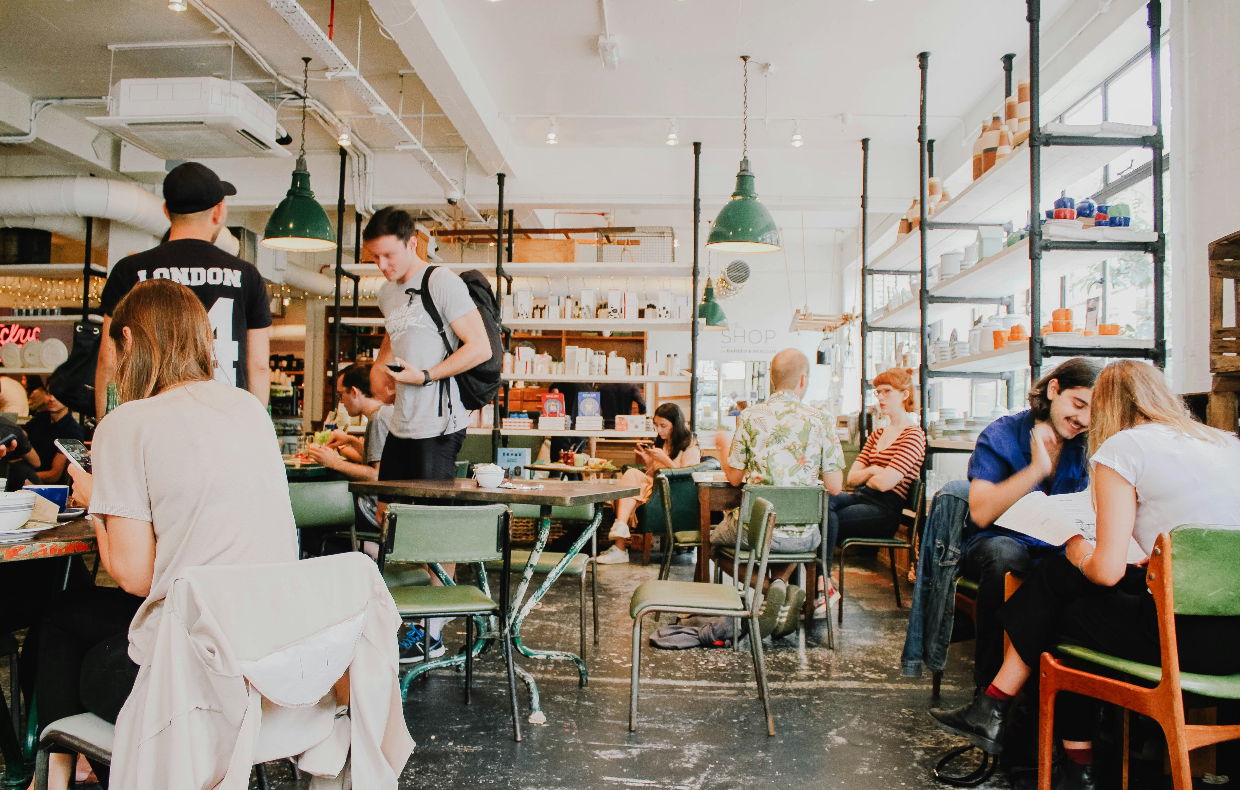Busy cafe interior with people enjoying their time.