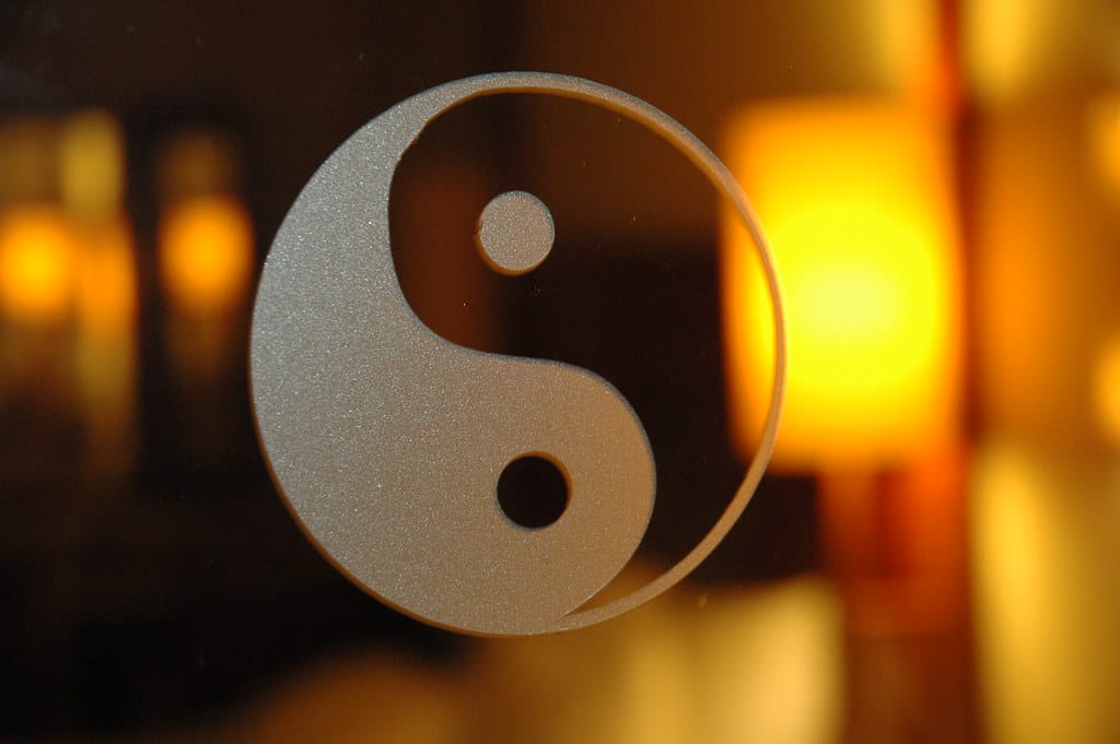 Yin yang symbol with warm light background