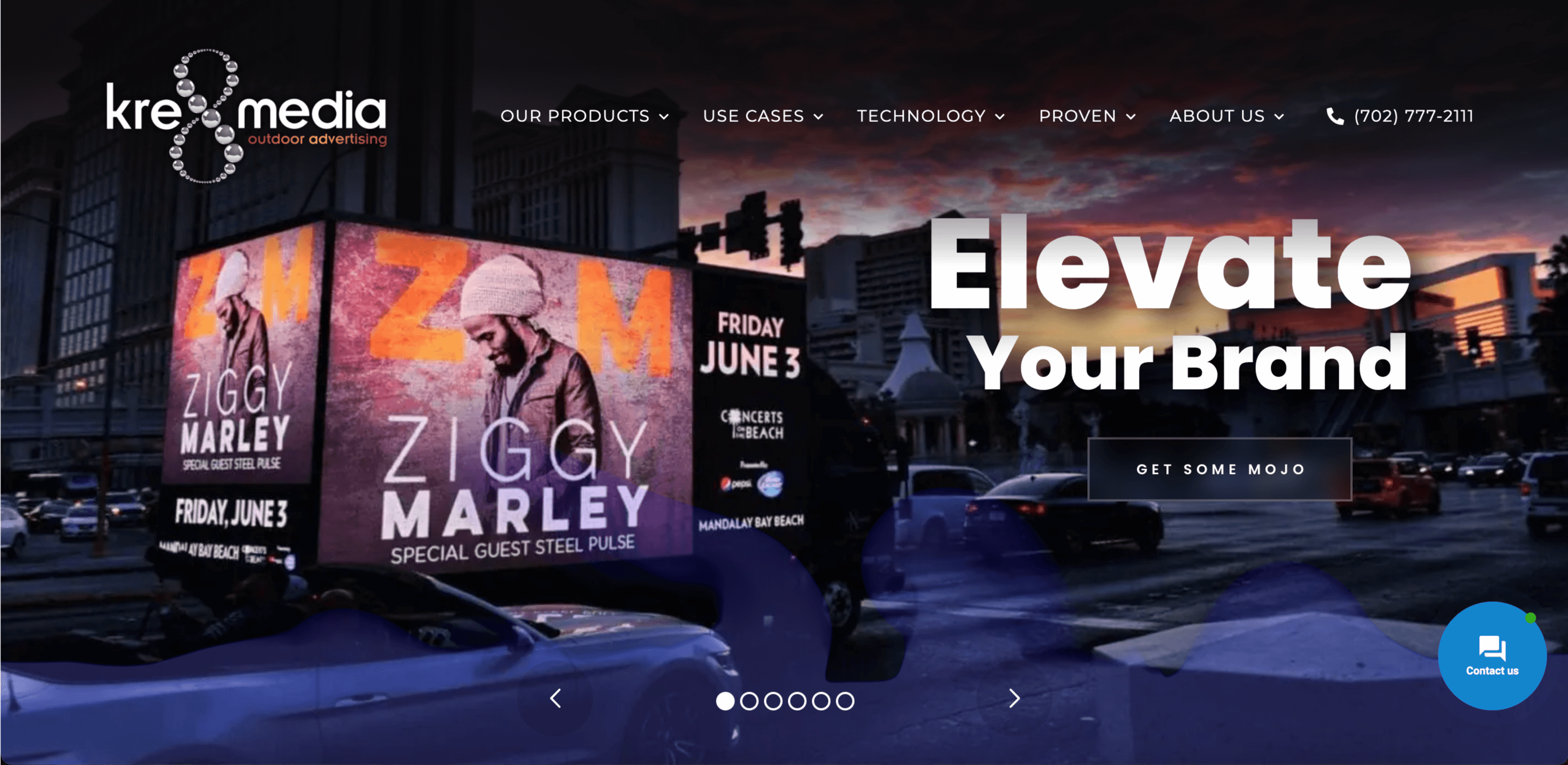 Digital billboard advertising in city at sunset